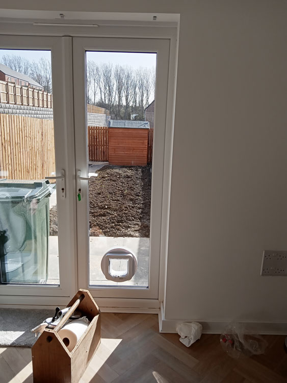 Cat flap fitters in glass