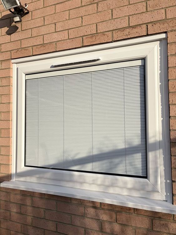 New window with integral blinds installed New window with integral blinds installed